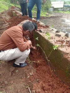 Shekhar-Garud-sir--planting-the-vernonia-sapling-along-the-compund-wall-of-canteen-extension-dated-12th-july-2019